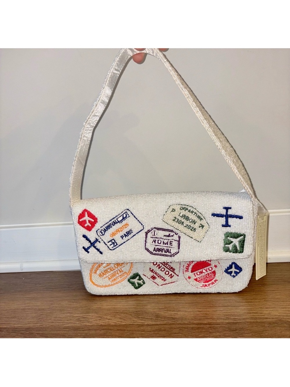 NWT VIRAL beaded passport / travel bag
$70